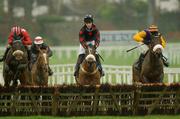 26 December 2002; Party Airs, left, with Barry Geraghty up, jumps the last ahead of Kenilworth, with Joey Elliot up, and Harchibald, right, with Paul Carberry up, on their way to win The Denny Juvenile Hurdle, Leopardstown Racecourse, Foxrock, Co. Dublin. Horse racing . Picture credit; Ray McManus / SPORTSFILE *EDI*