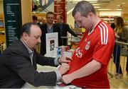 13 September 2012; Former Liverpool FC manager Rafa Benitez signs the jersey of Ruairi Sheridan, from Dorset St., Dublin, during a signing session for his new book, Champions League Dreams, which is available from Eason stores nationwide and from easons.com. Rafa Benitez Book Signing, Easons, O'Connell Street, Dublin. Picture credit: Brian Lawless / SPORTSFILE