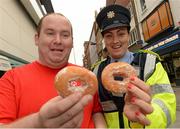15 September 2012; Philip O'Reilly, Ballymun, and Garda Michelle Fitzpatrick, from Store Street Garda Staion, were on hand to sell donuts from Dolly’s Donut Shop on Dublin’s Henry Street today. The Cops on Donut shops event was organised to raise funds for Special Olympics Ireland. Henry Street, Dublin. Photo by Sportsfile