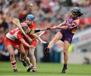 16 September 2012; Claire O'Connor, Wexford, in action against Sile Burns, left, and Briege Corkery, Cork. All-Ireland Senior Camogie Championship Final, Cork v Wexford, Croke Park, Dublin. Picture credit: David Maher / SPORTSFILE
