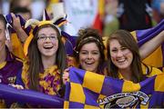 16 September 2012; Wexford supporters, from left to right, Niamh Whitty, Anna Whitty and Ciara Roche, all from Cranford, Co. Wexford, celebrate during the game. All-Ireland Senior Camogie Championship Final, Cork v Wexford, Croke Park, Dublin. Picture credit: Matt Browne / SPORTSFILE