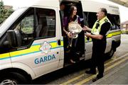 17 September 2012; Wexford's Mary Leacy holds the O'Duffy Cup as she steps out from a Garda Síochána van with Garda Bill Hernon, from Crumlin Garda station, during a visit to Our Lady's Hospital for Sick Children, Crumlin, Dublin. Picture credit: David Maher / SPORTSFILE