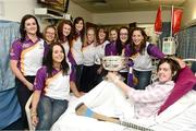 17 September 2012; Leanne Quigley, from Aughrim, Co. Wicklow, holds the O'Duffy Cup alongside members of the Wexford team during a visit to Our Lady's Hospital for Sick Children, Crumlin, Dublin. Picture credit: David Maher / SPORTSFILE