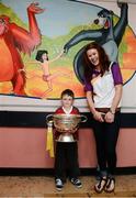 17 September 2012; Jamie Robinson, age 6, from Walkinstown, Dublin, holds the O'Duffy Cup alongside Wexford's Louise Codd during a visit to Our Lady's Hospital for Sick Children, Crumlin, Dublin. Picture credit: David Maher / SPORTSFILE