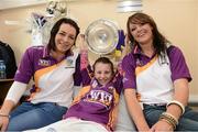 17 September 2012; Rachel Goff, age 8, from Enniscorthy, Co. Wexford, holds the O'Duffy Cup with Wexford's Ursula Jacob, left, and Karen Athkinson during a visit to Our Lady's Hospital for Sick Children, Crumlin, Dublin. Picture credit: David Maher / SPORTSFILE
