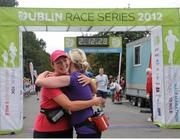 15 September 2012; Sinead Muldoon, left, and Niamh Murphy, both from Co. Westmeath, congratulate eachother after completing the Dublin Half Marathon. Entrants ran, walked and jogged the 13 mile course in what was the fourth and final race in the four part Dublin Race series. The Half Marathon represents the last major hurdle for Marathon hopefuls ahead of the Dublin Marathon on October 29th. Entry remains open for the Dublin Marathon until Monday 1st October see www.dublinmarathon.ie for more details. Dublin Race Series Half Marathon 2012, Phoenix Park, Dublin. Picture credit: Tomas Greally / SPORTSFILE