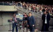 Undated picture, probably 1972, of Michael O'Hehir beside an RTÉ camera in the entrance to the Hogan Stand, Croke Park, Dublin. Picture credit: Connolly Collection / SPORTSFILE