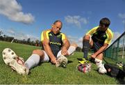 18 September 2012; Munster's BJ Botha, left, and Donncha O'Callaghan put on their boots during squad training ahead of their side's Celtic League, Round 4, match against Newport Gwent Dragons on Saturday. Cork Institute of Technology, Bishopstown, Cork. Picture credit: Diarmuid Greene / SPORTSFILE