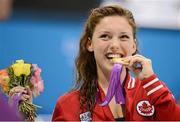 31 August 2012; Brianna Nelson, Canada, celebrates with her Gold medal after winning the Women's 50m Butterfly - S7. London 2012 Paralympic Games, Swimming, Aquatics Centre, Olympic Park, Stratford, London, England. Picture credit: Brian Lawless / SPORTSFILE