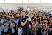 20 September 2012; In attendance at the launch of Leinster Rugby’s 2012 Heineken Cup trophy tour at St. Laurence’s National School, Sallins, Co. Kildare, is former pupil, Leinster Academy Player Sam Coghlan Murray with pupils from his old school. Those interested in turning their school Leinster Blue and receiving a visit from the Heineken cup on its tour should email - trophy@leinsterrugby.ie. Over 250 schools are confirmed to receive the Heineken Cup to date, meaning over 50,000 plus school pupils will have the opportunity to see the cup and learn more about rugby. Leinster fans can keep up to date on the Heineken Cup’s tour by following @leinstertrophytour on Twitter or at www.Facebook.com/leinsterrugbytrophytour! St Laurence's National School, Sallins, Co. Kildare. Picture credit: Matt Browne / SPORTSFILE