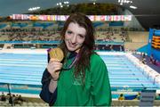 31 August 2012; Ireland's Bethany Firth, from Seaforde, Co. Down, celebrates with her gold medal after winning the women's 100m backstroke - S14. London 2012 Paralympic Games, Swimming, Aquatics Centre, Olympic Park, Stratford, London, England. Picture credit: Brian Lawless / SPORTSFILE