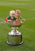 21 September 2012; Nine month old Grace Ní Murchú, wearing the Mayo colours, and Ronan Cassidy, 11 months, from Donegal Town, with the Sam Maguire Cup ahead of the GAA Football All-Ireland Senior Championship Final between Donegal and Mayo in Croke Park on Sunday. Croke Park, Dublin. Picture credit: Ray McManus / SPORTSFILE