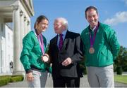 21 September 2012; President of Ireland Michael D. Higgins with Team Ireland's Katie Taylor and Cian O'Connor at a reception for the London 2012 Irish Olympic team at Aras an Uachtarain, Phoenix Park, Dublin. Picture credit: Brian Lawless / SPORTSFILE