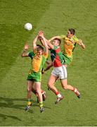 23 September 2012; Leo McLoone, left, and Rory Kavanagh, Donegal, in action against Barry Moran, left, and Aidan O'Shea, Mayo. GAA Football All-Ireland Senior Championship Final, Donegal v Mayo, Croke Park, Dublin. Picture credit: Daire Brennan / SPORTSFILE