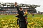 23 September 2012; Donegal manager Jim McGuinness, with his son Jimmy, age 8 months, celebrates after the game. GAA Football All-Ireland Senior Championship Final, Donegal v Mayo, Croke Park, Dublin. Picture credit: Brendan Moran / SPORTSFILE