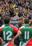 23 September 2012; Donegal captain Michael Murphy lifts the Sam Maguire cup watched by Mayo players Alan Dillon and Jason Doherty. GAA Football All-Ireland Senior Championship Final, Donegal v Mayo, Croke Park, Dublin. Picture credit: Brendan Moran / SPORTSFILE