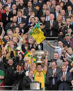 23 September 2012; Donegal captain Michael Murphy lifts the Sam Maguire cup in the company of An Taoiseach Enda Kenny, T.D. GAA Football All-Ireland Senior Championship Final, Donegal v Mayo, Croke Park, Dublin. Picture credit: Brendan Moran / SPORTSFILE