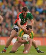 23 September 2012; Michael Murphy, Donegal, is tackled by Barry Moran, Mayo. GAA Football All-Ireland Senior Championship Final, Donegal v Mayo, Croke Park, Dublin. Picture credit: Brendan Moran / SPORTSFILE