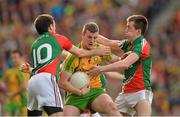 23 September 2012; Leo McLoone, Donegal, in action against Kevin McLoughlin, left, and Cillian O'Connor, Mayo. GAA Football All-Ireland Senior Championship Final, Donegal v Mayo, Croke Park, Dublin. Picture credit: Brendan Moran / SPORTSFILE