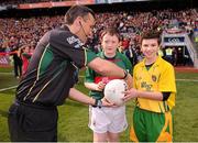 23 September 2012; Mascots Jack Malone, left, Mayo, and Jamie Crawford, Donegal, present the match football to referee Maurice Deegan before the start of the game. GAA Football All-Ireland Senior Championship Final, Donegal v Mayo, Croke Park, Dublin. Picture credit: David Maher / SPORTSFILE