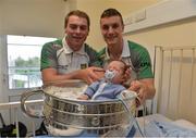 24 September 2012; Donegal's Dermot Molloy, left, and Leo McLoone with Oisín Bonner, aged 7, weeks from the Glenties, Co. Donegal, and the Sam Maguire Cup during a visit to Our Lady's Hospital for Sick Children, Crumlin, Dublin. Picture credit: Barry Cregg / SPORTSFILE