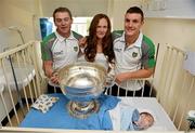 24 September 2012; Donegal's Dermot Molloy, left, and Leo McLoone with the Sam Maguire Cup along with Oisín Bonner, aged 7 weeks, from the Glenties, Co. Donegal, and his mother Caroline who is sister of Donegal's Marty Boyle, during a visit to Our Lady's Hospital for Sick Children, Crumlin, Dublin. Picture credit: Barry Cregg / SPORTSFILE
