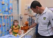 24 September 2012; Donegal's Frank McGlynn speaking to Matthew Murray, aged 2, from Letterkenny, Co. Donegal, during a visit to Our Lady's Hospital for Sick Children, Crumlin, Dublin. Picture credit: Barry Cregg / SPORTSFILE