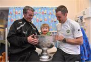 24 September 2012; Donegal manager Jim McGuinness, left, and player Karl Lacey with Matthew Murray, age 2, from Letterkenny, Co. Donegal, as he sits in the Sam Maguire Cup during a visit to Our Lady's Hospital for Sick Children, Crumlin, Dublin. Picture credit: Barry Cregg / SPORTSFILE