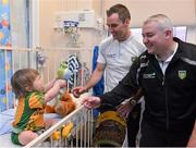 24 September 2012; Donegal goalkeeping coach Pat Shovelin, right, and player Karl Lacey with Matthew Murray, age 2, from Letterkenny, Co. Donegal, during a visit to Our Lady's Hospital for Sick Children, Crumlin, Dublin. Picture credit: Barry Cregg / SPORTSFILE
