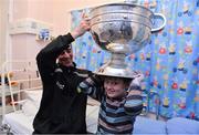24 September 2012; Donegal manager Jim McGuinness with Finn Geraghty, age 9, from Ranelagh, Dublin, and the Sam Maguire Cup during a visit to Our Lady's Hospital for Sick Children, Crumlin, Dublin. Picture credit: Barry Cregg / SPORTSFILE
