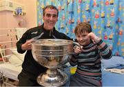 24 September 2012; Donegal manager Jim McGuinness with Finn Geraghty, age 9, from Ranelagh, Dublin, and the Sam Maguire Cup during a visit to Our Lady's Hospital for Sick Children, Crumlin, Dublin. Picture credit: Barry Cregg / SPORTSFILE