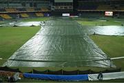 24 September 2012; The covers are removed from the pitch after a heavy rain shower. ICC World Twenty 20, Group B, Ireland v West Indies, Premadasa Stadium, Colombo, Sri Lanka. Picture credit: Rob O'Connor / SPORTSFILE
