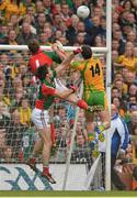 23 September 2012; Michael Murphy, Donegal, gets to the ball ahead of Mayo goalkeeper David Clarke and full-back Ger Cafferkey, to score a point. GAA Football All-Ireland Senior Championship Final, Donegal v Mayo, Croke Park, Dublin. Picture credit: Brendan Moran / SPORTSFILE