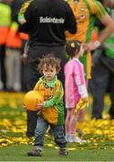 23 September 2012; Mark Anthony McGuinness, son of Donegal manager Jim McGuinness, plays with a football on the pitch after the presentation of the Sam Maguire cup. GAA Football All-Ireland Senior Championship Final, Donegal v Mayo, Croke Park, Dublin. Picture credit: Brendan Moran / SPORTSFILE