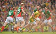 23 September 2012; Christy Toye, Donegal, in action against Mayo players, from left, Donal Vaughan, Richie Feeney, Barry Moran and Jason Gibbons. GAA Football All-Ireland Senior Championship Final, Donegal v Mayo, Croke Park, Dublin. Picture credit: Brendan Moran / SPORTSFILE