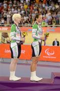 2 September 2012; Ireland's Catherine Walsh, left, from Swords, Dublin, and pilot Francine Meehan, from Killurin, Co. Offaly, stand on the podium with their silver medals after finishing in second place in the women's individual B pursuit final. London 2012 Paralympic Games, Cycling, Velodrome, Olympic Park, Stratford, London, England. Picture credit: Brian Lawless / SPORTSFILE