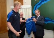26 September 2012; Leinster captain Leo Cullen presents An Taoiseach Enda Kenny T.D, right, with a Leinster jersey as Minister of State for Tourism & Sport Michael Ring T.D, looks on, during the the official opening of the new offices of Leinster Rugby at UCD, Belfield, Dublin. Picture credit: Matt Browne / SPORTSFILE