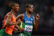 3 September 2012; Odair Santos, Brazil, and his guide Carlos Antonio dos Santos, on their way to finishing 2nd in the Men's 1500m - T11. London 2012 Paralympic Games, Athletics, Olympic Stadium, Olympic Park, Stratford, London, England. Picture credit: Brian Lawless / SPORTSFILE