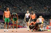 3 September 2012; Samwel Mushai Kimani, Kenya, is assisted by his guide James Boit, after they won the Men's 1500m - T11 in a World record time of 3:58.37. London 2012 Paralympic Games, Athletics, Olympic Stadium, Olympic Park, Stratford, London, England. Picture credit: Brian Lawless / SPORTSFILE