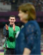 3 September 2012; Ireland's Michael McKillop, from Newtownabbey, Co. Antrim, applauds his mother Catherine as she presents the medals for the men's 1500m - T37 final in a time of 4.08:11. London 2012 Paralympic Games, Athletics, Olympic Stadium, Olympic Park, Stratford, London, England. Picture credit: Brian Lawless / SPORTSFILE