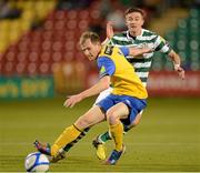 28 September 2012; Ronan Finn, Shamrock Rovers, in action against Mark O'Brien, Dundalk. Airtricity League Premier Division, Shamrock Rovers v Dundalk, Tallaght Stadium, Tallaght, Co. Dublin. Picture credit: David Maher / SPORTSFILE