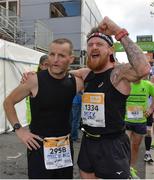 29 October 2017; Michael McDonnell, left, and Mark Dempsey, react following the SSE Airtricity Dublin Marathon 2017 at Merrion Square in Dublin City. 20,000 runners took to the Fitzwilliam Square start line to participate in the 38th running of the SSE Airtricity Dublin Marathon, making it the fifth largest marathon in Europe. Photo by Sam Barnes/Sportsfile