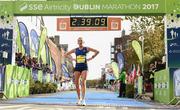 29 October 2017; Laura Graham of Mourne Runners, Co Down, crosses the line to be the first Irish finisher in the women's category of SSE Airtricity Dublin Marathon 2017 at Merrion Square in Dublin City. 20,000 runners took to the Fitzwilliam Square start line to participate in the 38th running of the SSE Airtricity Dublin Marathon, making it the fifth largest marathon in Europe. Photo by Sam Barnes/Sportsfile