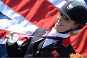 4 September 2012; Sophie Wells, Great Britain, celebrates with her Silver medal after the dressage individual freestyle test - Grade IV. London 2012 Paralympic Games, Equestrian, Greenwich Park, Greenwich, London, England. Picture credit: Brian Lawless / SPORTSFILE