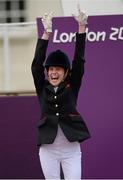 4 September 2012; Gold medal winner, in the dressage individual freestyle test - Grade Ia, Sophie Christiansen, Great Britain, celebrates as she takes to the podium. London 2012 Paralympic Games, Equestrian, Greenwich Park, Greenwich, London, England. Picture credit: Brian Lawless / SPORTSFILE