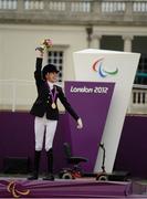 4 September 2012; Gold medal winner, in the dressage individual freestyle test - Grade Ia, Sophie Christiansen, Great Britain, celebrates as she takes to the podium. London 2012 Paralympic Games, Equestrian, Greenwich Park, Greenwich, London, England. Picture credit: Brian Lawless / SPORTSFILE