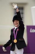 4 September 2012; Gold medal winner, in the dressage individual freestyle test - Grade Ia, Sophie Christiansen, Great Britain, celebrates as she takes to the podium. London 2012 Paralympic Games, Equestrian, Greenwich Park, Greenwich, London, England. Picture credit: Brian Lawless / SPORTSFILE