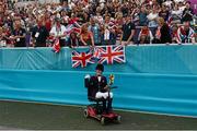 4 September 2012; Gold medal winner, in the dressage individual freestyle test - Grade Ia, Sophie Christiansen, Great Britain, celebrates with supporters. London 2012 Paralympic Games, Equestrian, Greenwich Park, Greenwich, London, England. Picture credit: Brian Lawless / SPORTSFILE