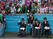 4 September 2012; Ireland's equestrian team, from left, Eilish Byrne, from Dundalk, Co. Louth, James Dwyer, from Mooncoin, Co. Kilkenny, Geraldine Savage, from Dublin, and Helen Kearney, from Dunlaven, Co. Wicklow, celebrate with their bronze medals in the equestrian team championship. London 2012 Paralympic Games, Equestrian, Greenwich Park, Greenwich, London, England. Picture credit: Brian Lawless / SPORTSFILE