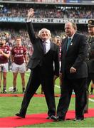 30 September 2012; President of Ireland Michael D. Higgins waves to the crowd after meeting the teams alongside Uachtarán Chumann Lúthchleas Gael Liam Ó Néill, right. GAA Hurling All-Ireland Senior Championship Final Replay, Kilkenny v Galway, Croke Park, Dublin. Picture credit: Pat Murphy / SPORTSFILE